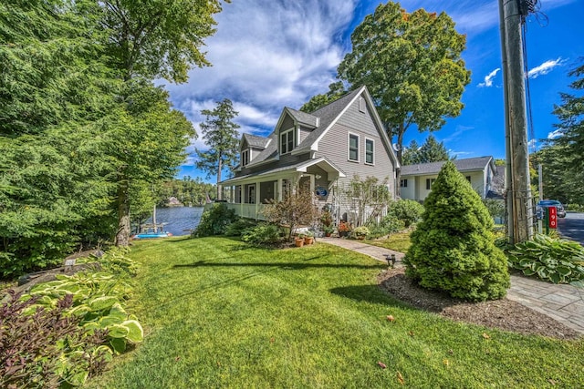 view of front of house featuring a water view and a front yard