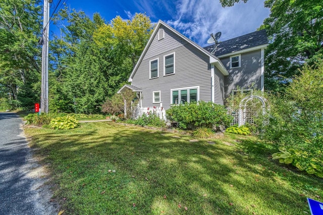 view of home's exterior featuring a lawn