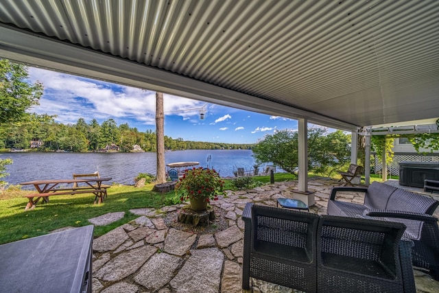 view of patio featuring a water view and an outdoor hangout area