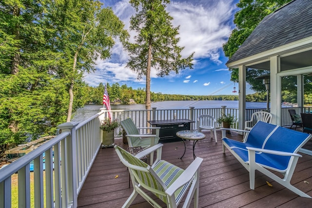 deck featuring a water view
