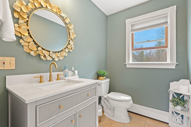 half bathroom with vanity, toilet, baseboards, tile patterned floors, and a baseboard radiator