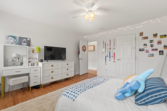 bedroom featuring a ceiling fan and wood finished floors