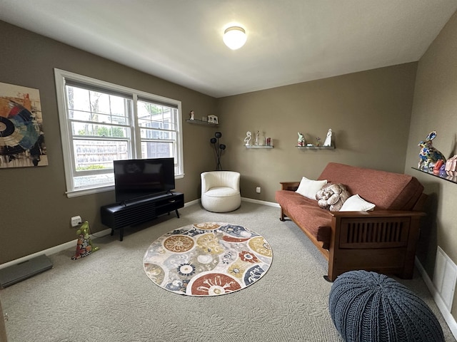 living room featuring carpet floors and baseboards