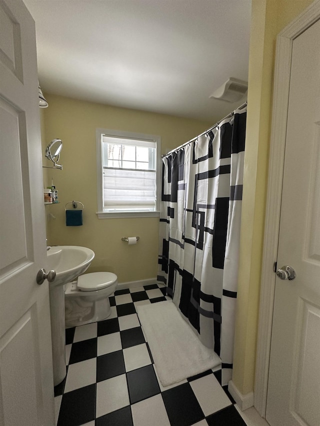 full bathroom with tile patterned floors, baseboards, toilet, and a shower with shower curtain