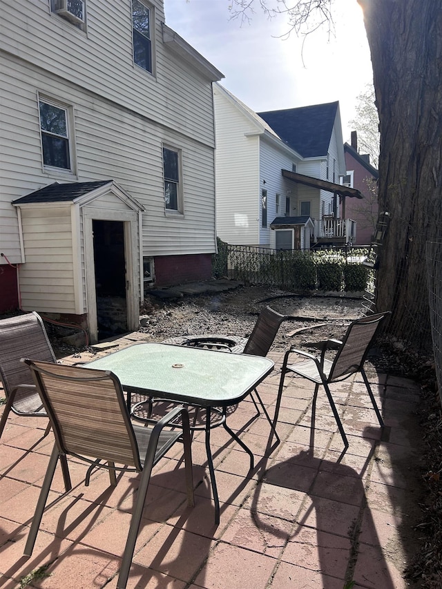 view of patio / terrace with outdoor dining area and fence