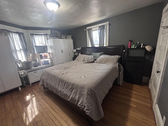 bedroom with hardwood / wood-style floors