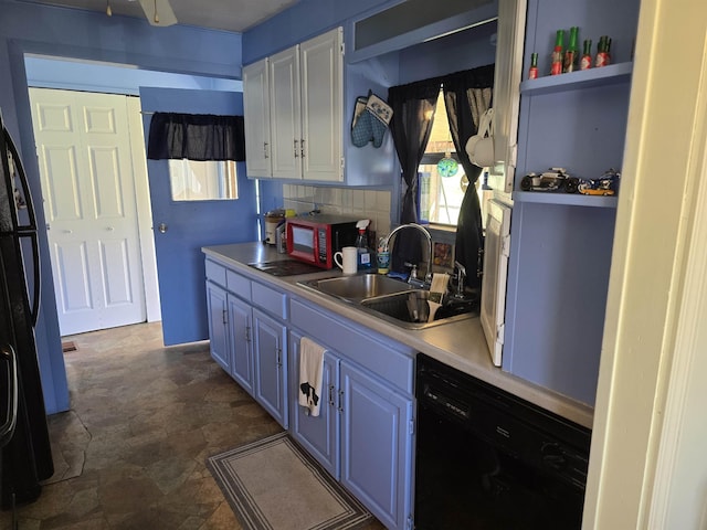 kitchen with light countertops, tasteful backsplash, a sink, dishwasher, and blue cabinetry