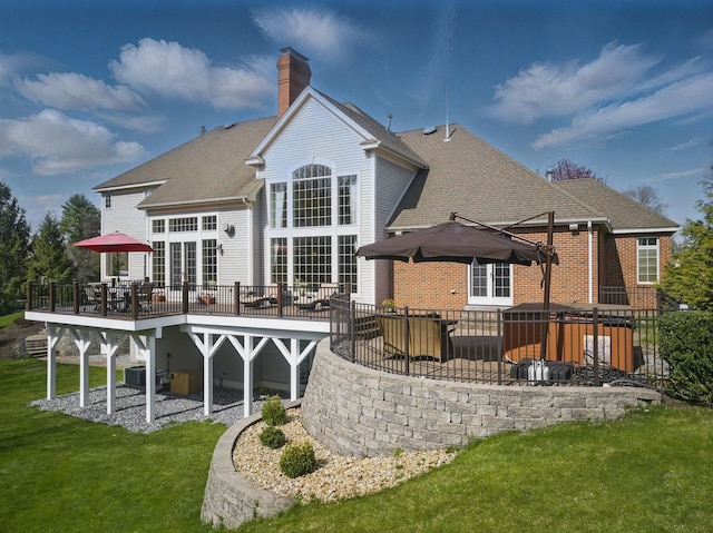 7 Champagne Ter, Bedford, NH 03110 - back of property featuring a wooden deck, roof with shingles, a chimney, a patio area, and a lawn