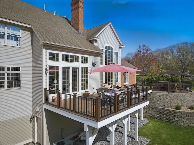 7 Champagne Ter, Bedford, NH 03110 - back of property with a shingled roof and a chimney