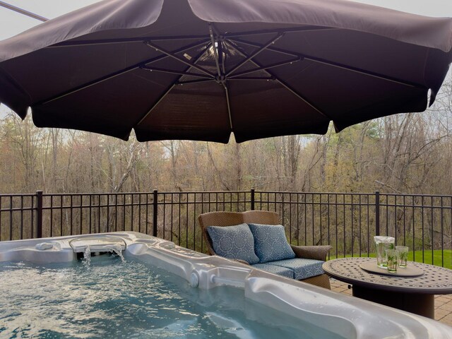 7 Champagne Ter, Bedford, NH 03110 - exterior space featuring a hot tub, a forest view, and fence
