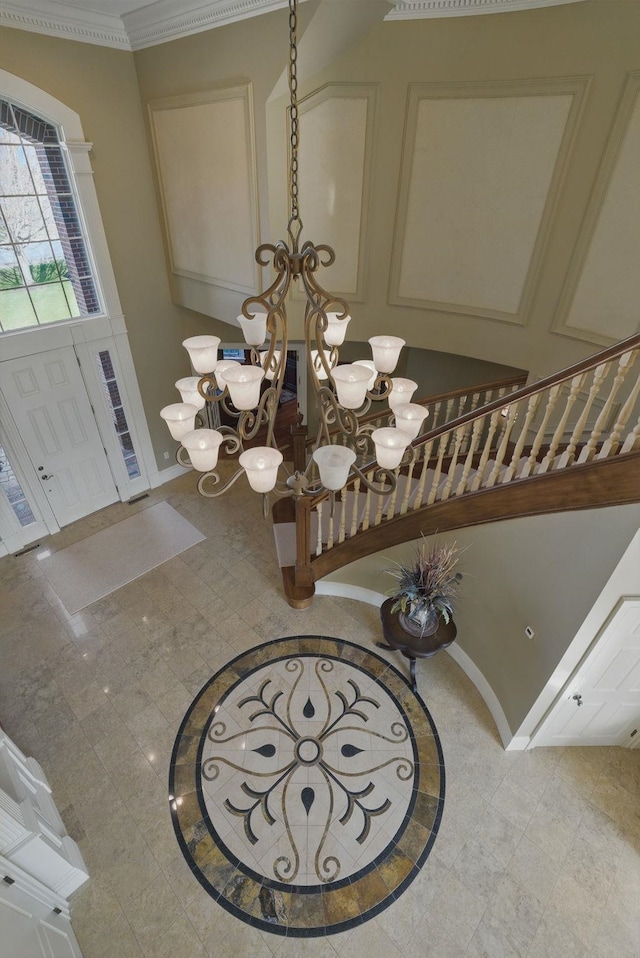 7 Champagne Ter, Bedford, NH 03110 - entrance foyer featuring an inviting chandelier, ornamental molding, and baseboards