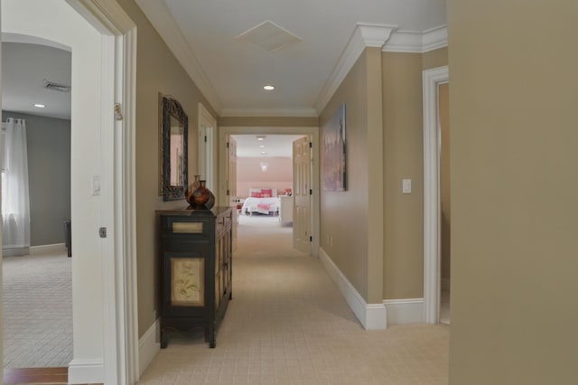 7 Champagne Ter, Bedford, NH 03110 - hallway featuring baseboards, ornamental molding, light carpet, and visible vents