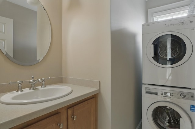 7 Champagne Ter, Bedford, NH 03110 - laundry room featuring a sink, stacked washer and clothes dryer, and laundry area
