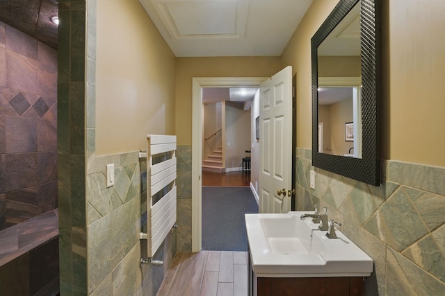 7 Champagne Ter, Bedford, NH 03110 - bathroom with vanity, wainscoting, and tile walls
