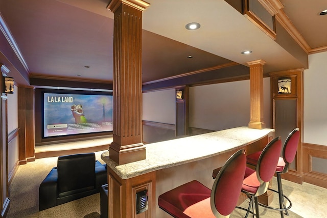 7 Champagne Ter, Bedford, NH 03110 - home theater room featuring ornate columns, ornamental molding, carpet, and wainscoting