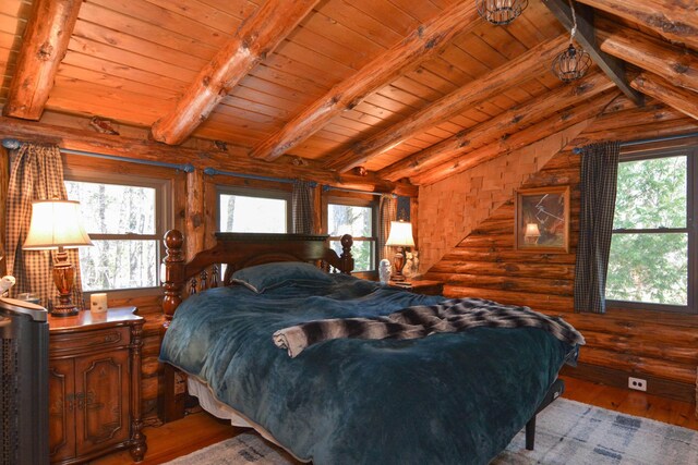 bedroom with wooden ceiling, multiple windows, and hardwood / wood-style floors