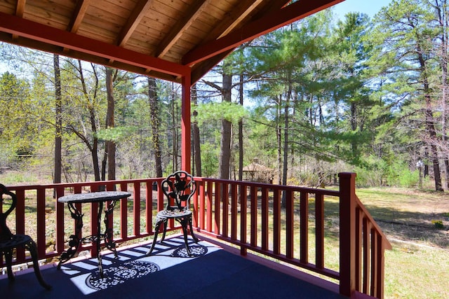 wooden deck featuring a wooded view
