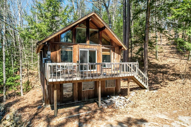 rear view of property with a wooden deck