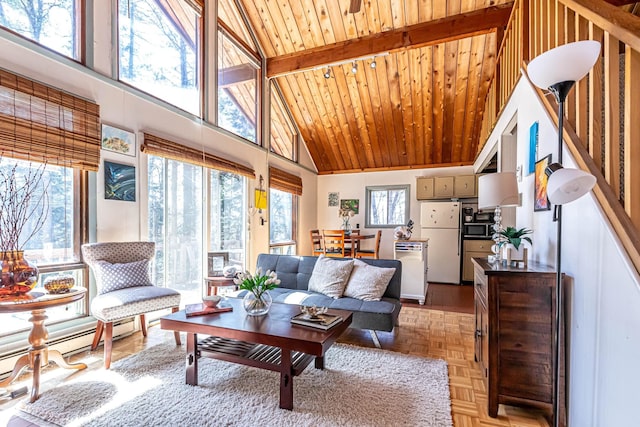 living room with wood ceiling, high vaulted ceiling, a healthy amount of sunlight, and a baseboard radiator