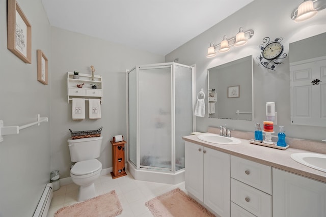 full bathroom with a sink, double vanity, toilet, a shower stall, and a baseboard radiator