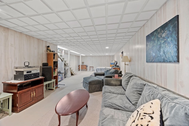 living room featuring carpet floors and stairs