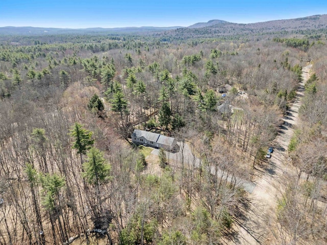 bird's eye view with a mountain view and a wooded view