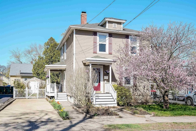 traditional style home featuring a chimney