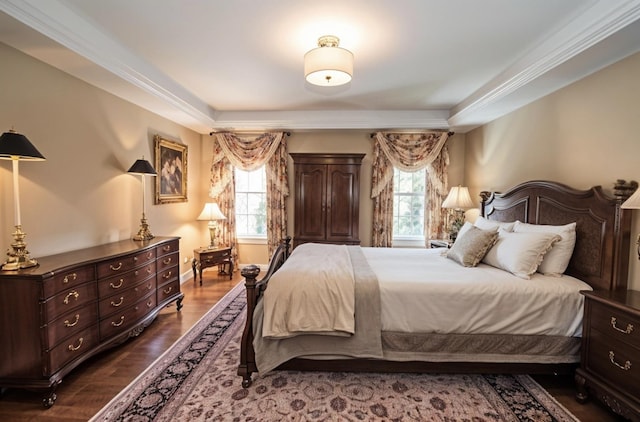 bedroom featuring multiple windows, ornamental molding, and dark wood-type flooring