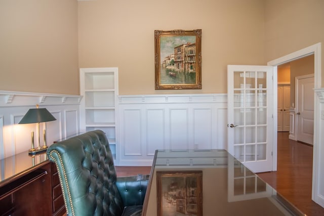 office with wainscoting and wood finished floors