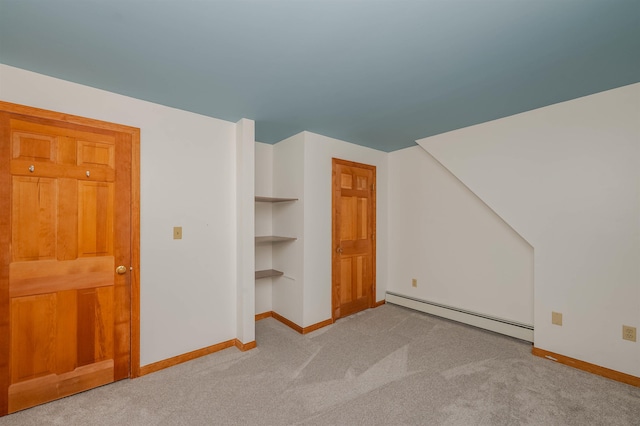 bonus room featuring baseboards, a baseboard radiator, and carpet