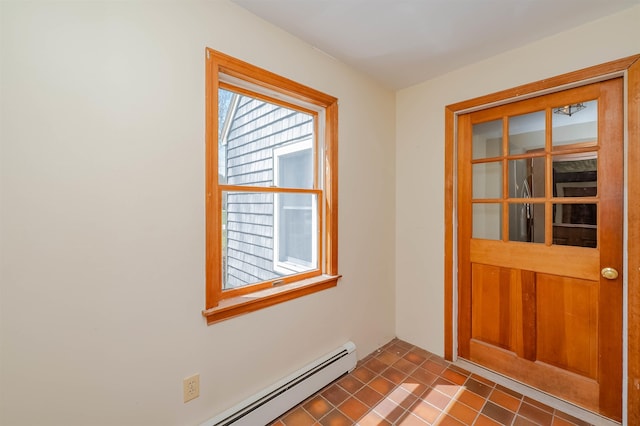 doorway to outside featuring a baseboard heating unit