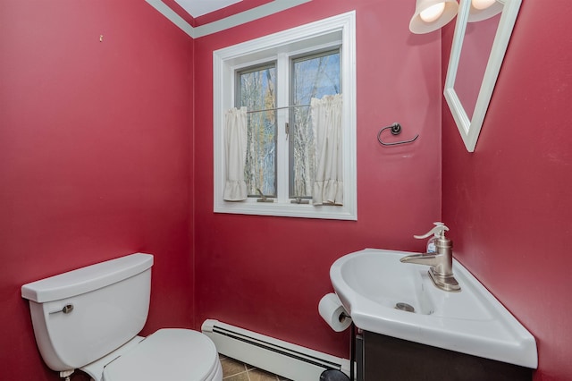 bathroom with vanity, tile patterned floors, a baseboard heating unit, and toilet