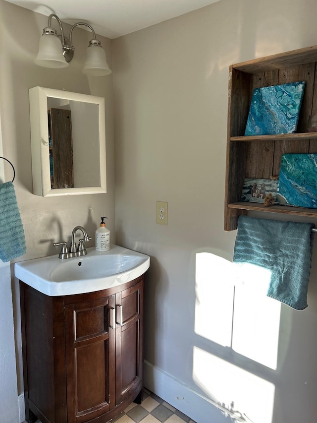 bathroom featuring baseboards and vanity