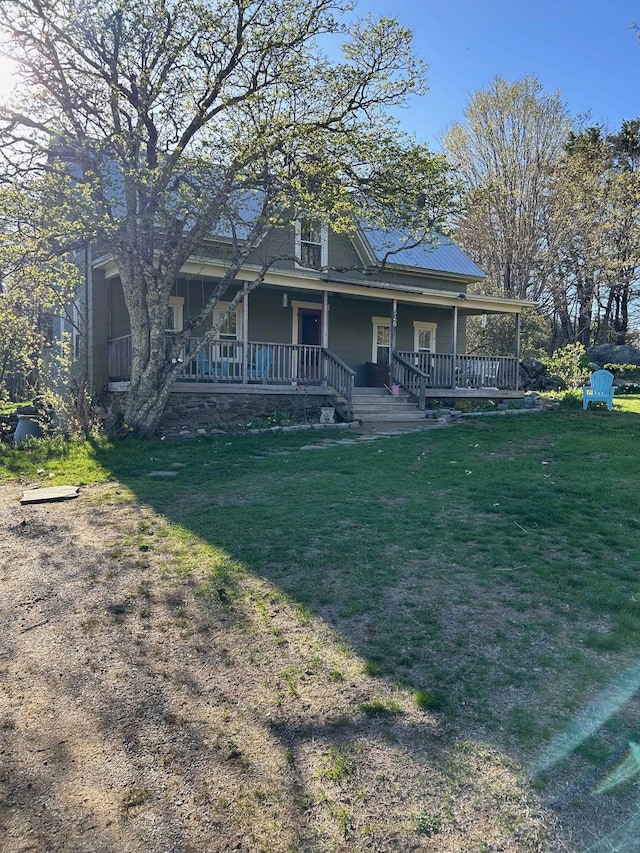 farmhouse-style home with a porch and a front yard