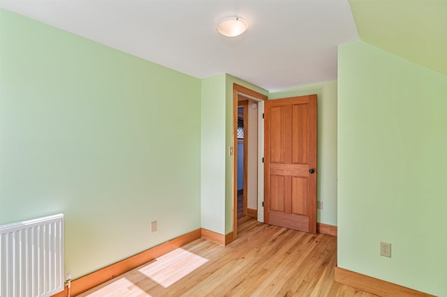 unfurnished bedroom featuring baseboards and light wood-style floors