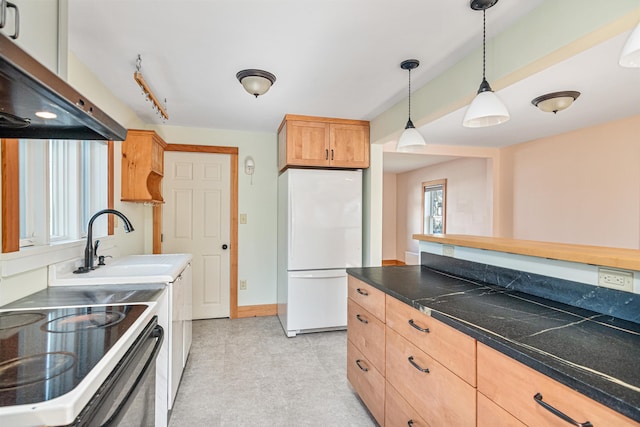 kitchen featuring exhaust hood, electric range, hanging light fixtures, a sink, and freestanding refrigerator