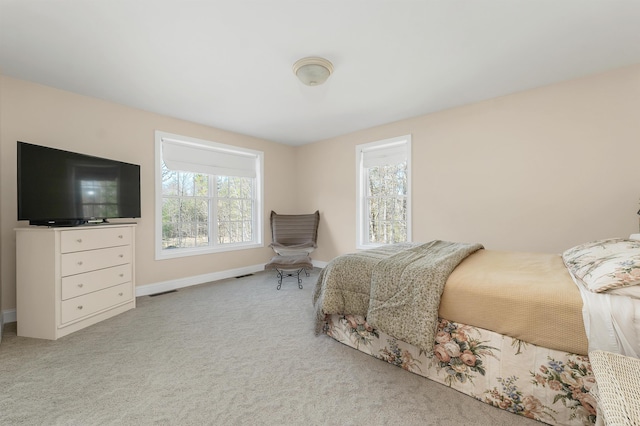 bedroom with carpet flooring, baseboards, and visible vents