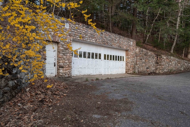 garage with aphalt driveway