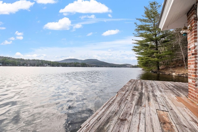 dock area featuring a water and mountain view