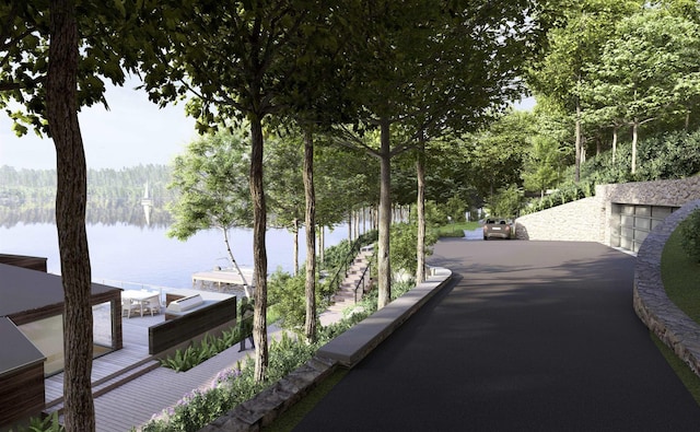 exterior space with a view of trees and a dock