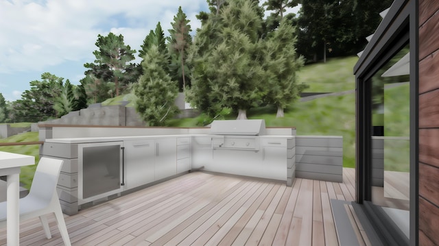 wooden deck featuring area for grilling
