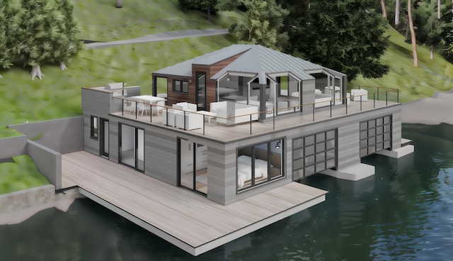 back of property featuring a water view, metal roof, and a balcony