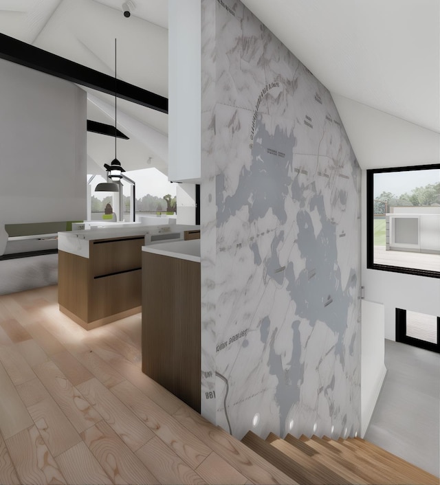 interior space featuring beamed ceiling and wood finished floors
