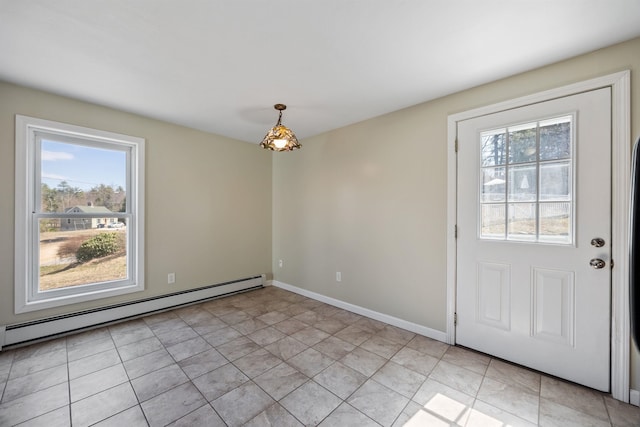 unfurnished dining area featuring light tile patterned floors, baseboards, and baseboard heating