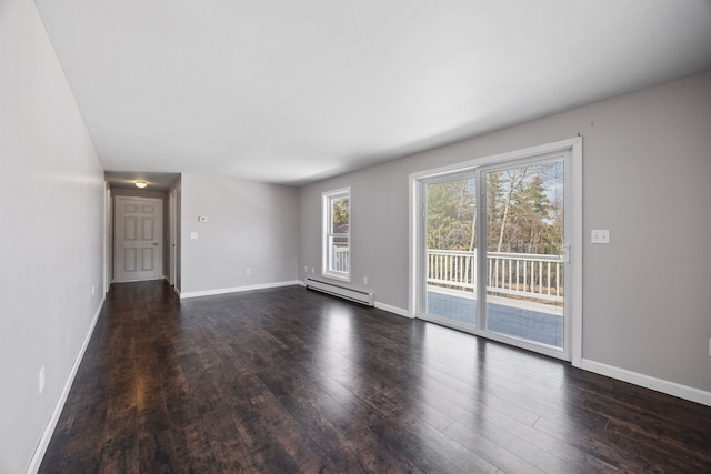 unfurnished living room with baseboards, a baseboard heating unit, and dark wood finished floors