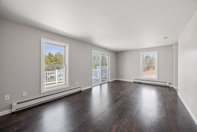 unfurnished living room featuring wood-type flooring, baseboards, a baseboard heating unit, and baseboard heating
