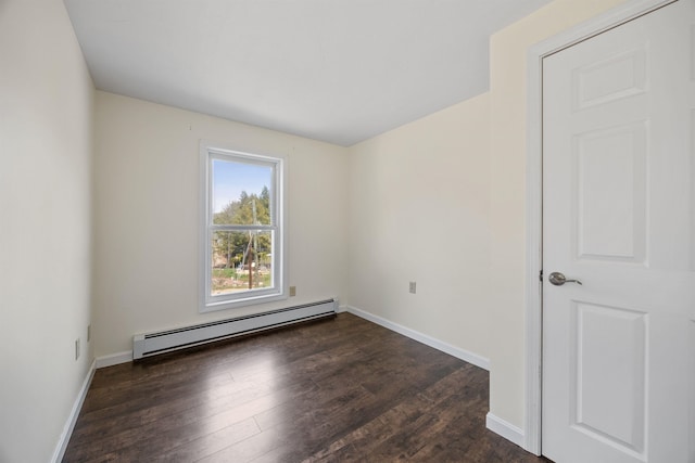 empty room with baseboards, a baseboard radiator, and dark wood-type flooring