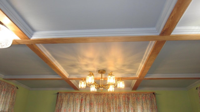 room details featuring coffered ceiling, a notable chandelier, and beamed ceiling