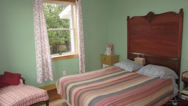 bedroom with wood finished floors