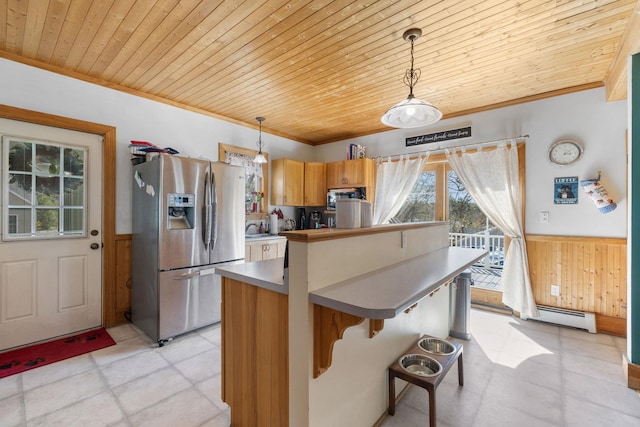 kitchen with stainless steel refrigerator with ice dispenser, crown molding, wainscoting, wooden ceiling, and a baseboard heating unit